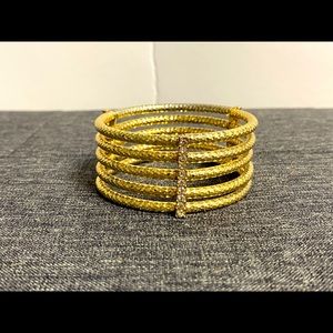 Gold coloured bracelet with diamonds